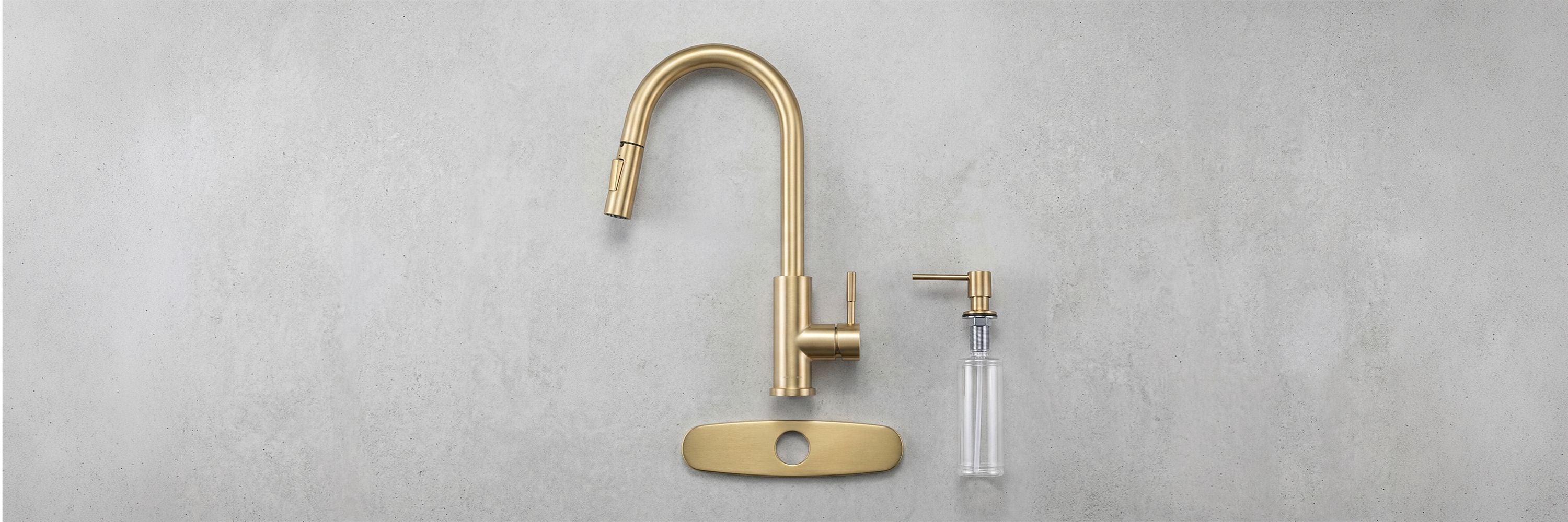 Brushed gold Imperium touch control kitchen faucet with pull-out sprayer, installed with matching Concetta deck plate and Bourg stainless steel soap dispenser on a white countertop.