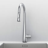 Front view of Arcus Touch Kitchen Faucet with Pull-Down Sprayer in brushed nickel, installed on a stainless steel sink by Signature Faucets. #color_brushed nickel