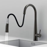 Arcus Touch Kitchen Faucet with flexible pull-down sprayer extended over sink, featuring gunmetal gray finish and ergonomic design by Signature Faucets. #color_gunmetal gray