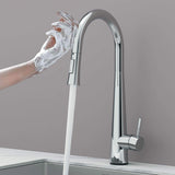 Touch-activated Arcus Kitchen Faucet with Pull-Down Sprayer in chrome finish — hands-free operation shown as soapy hands activate water flow by Signature Faucets. #color_chrome