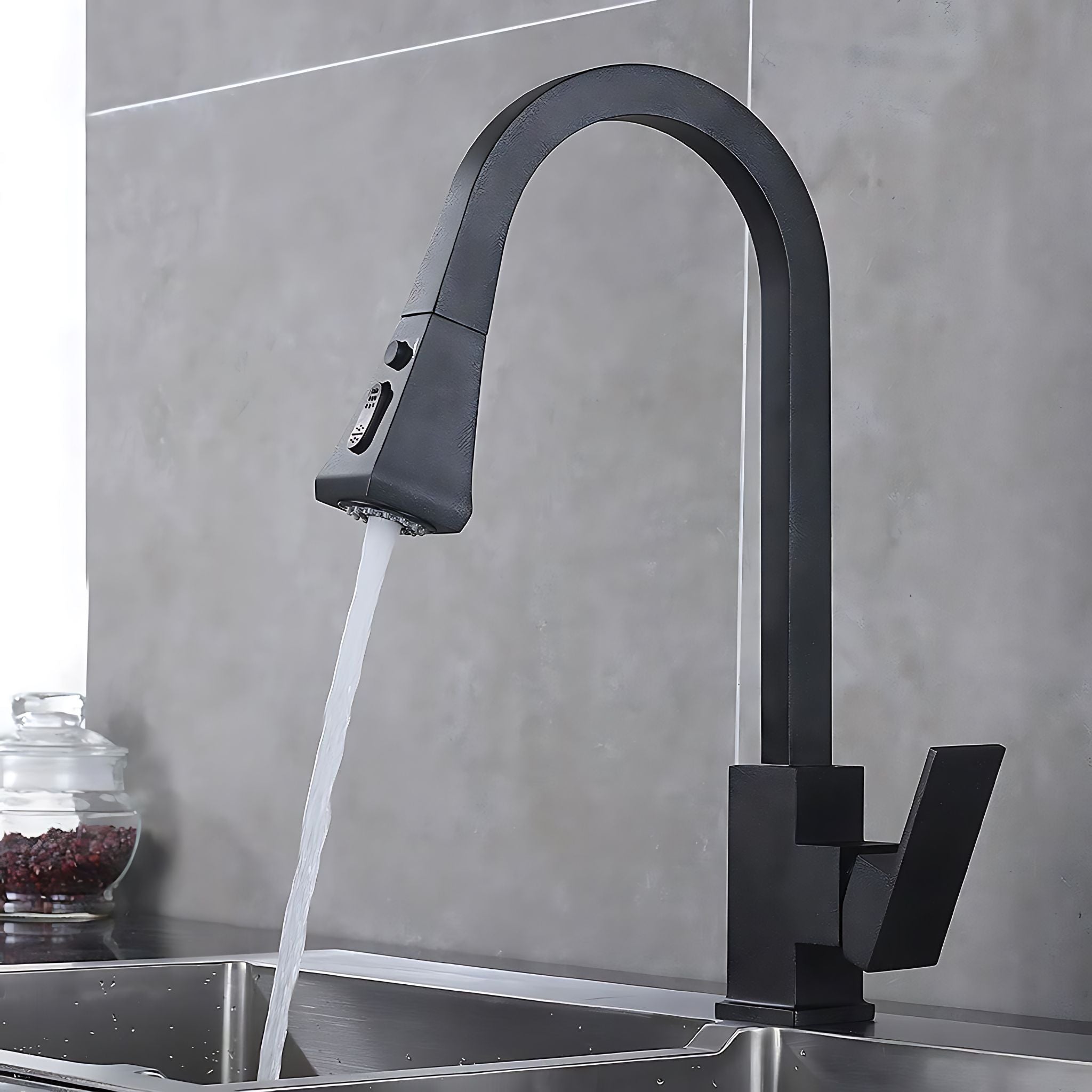 Black kitchen faucet with water flowing into a sink against a gray tiled wall. #color_matte black