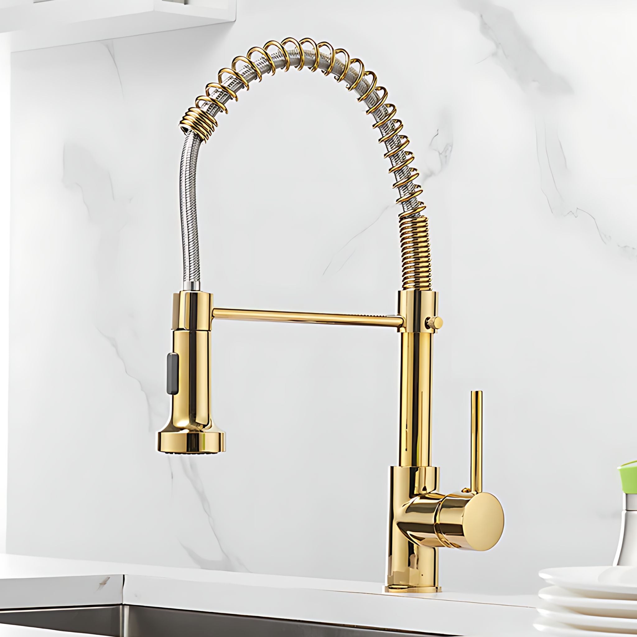A modern kitchen faucet with a polished gold finish, featuring a high-arc flexible spring hose and a single lever handle, set against a white marble backsplash. #color_gold
