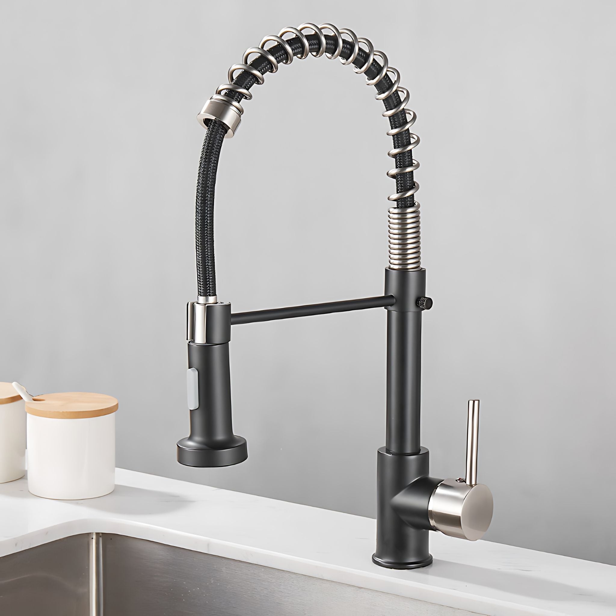 Black kitchen faucet with flexible hose on a gray background #color_matte black and brushed nickel