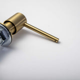 Close-up of the Berg Kitchen Sink Soap Dispenser pump head and spout in Brushed Gold.
