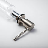 A stainless steel kitchen sink soap dispenser with a clear container and a brushed nickel finish