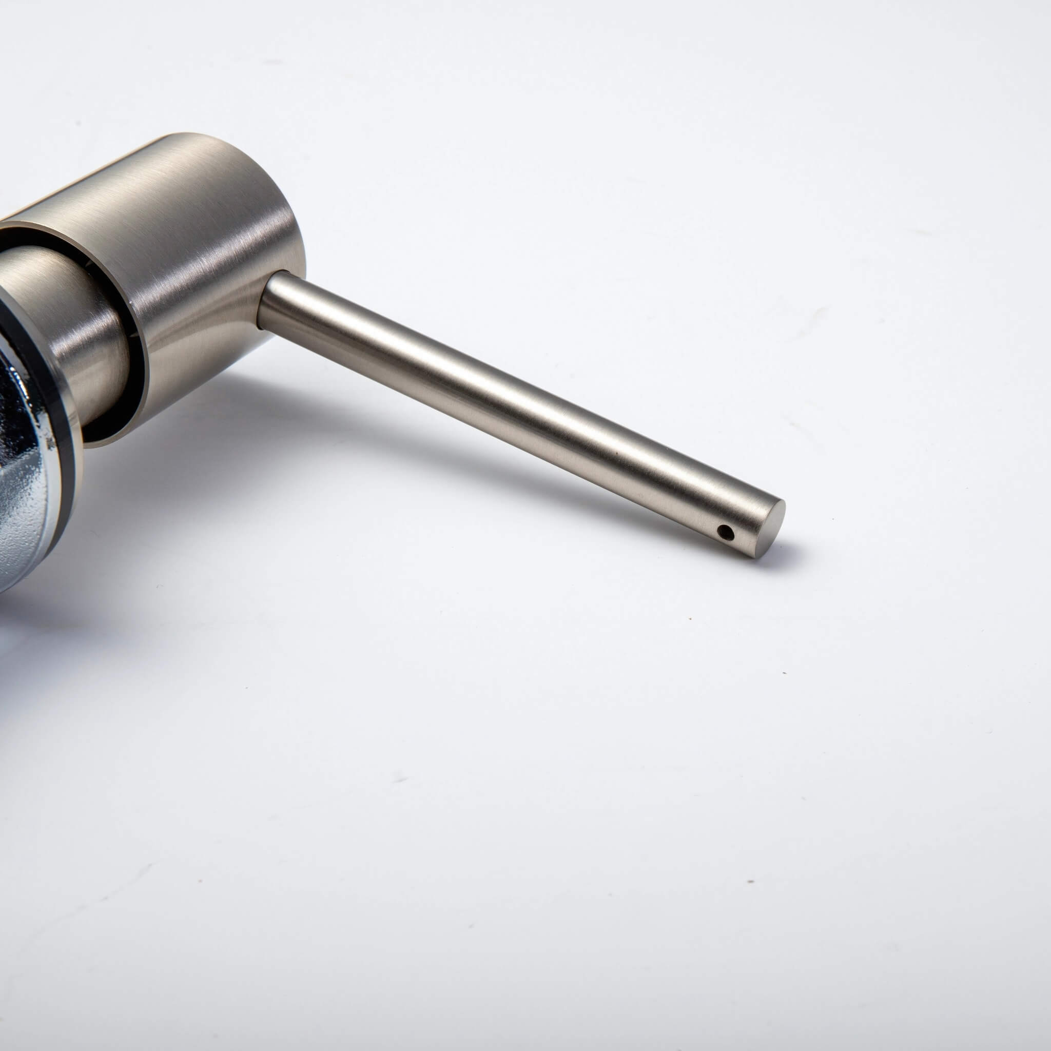 A stainless steel kitchen sink soap dispenser with a clear container and a brushed nickel finish