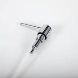 A stainless steel kitchen sink soap dispenser with a chrome finish with a white background.