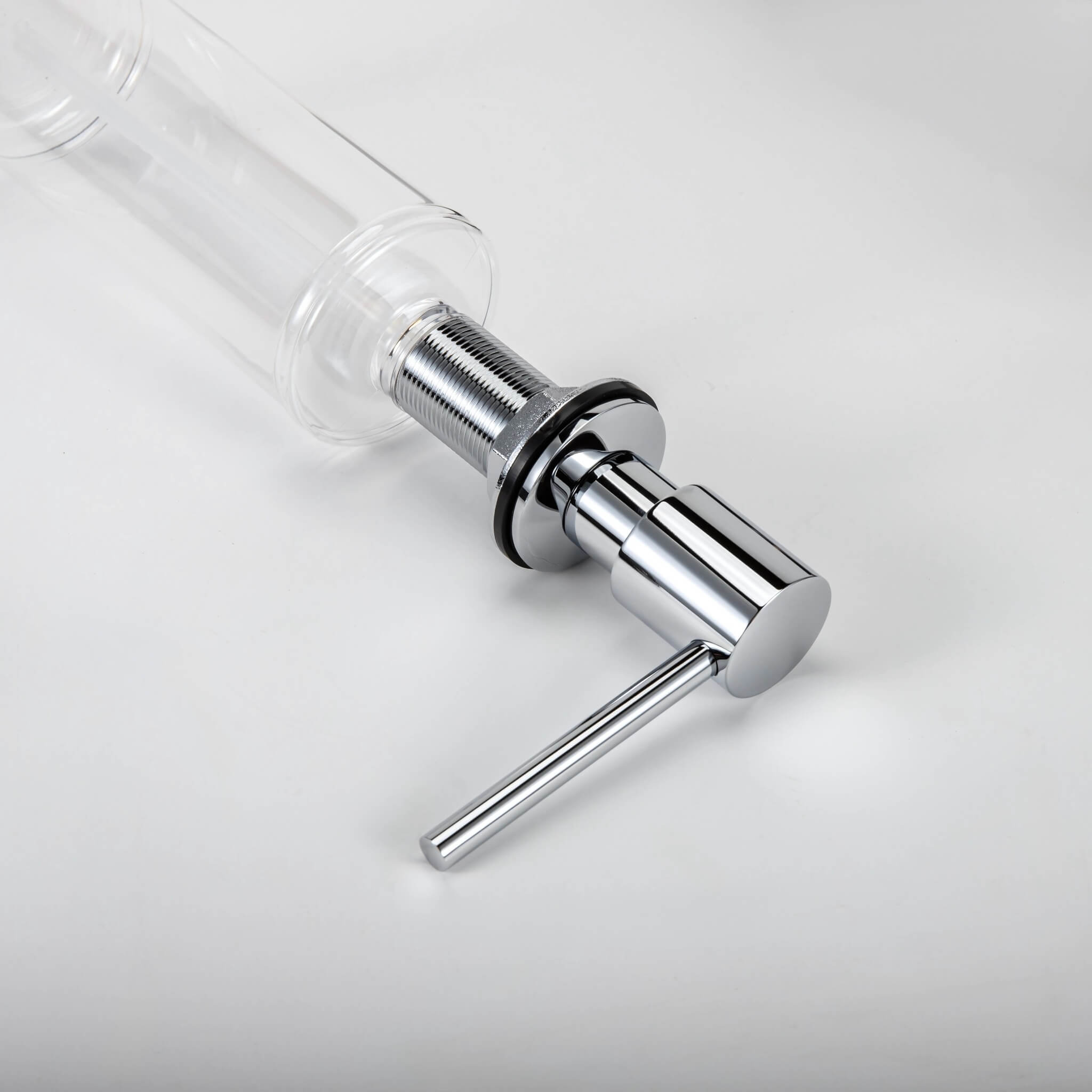A stainless steel kitchen sink soap dispenser with a clear container and a chrome finish