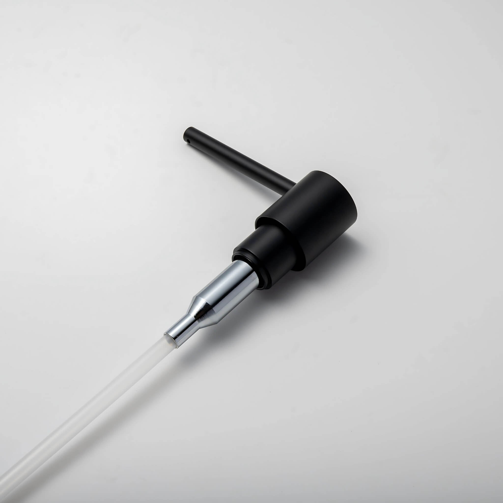 A stainless steel kitchen sink soap dispenser with a clear container and a matte black finish