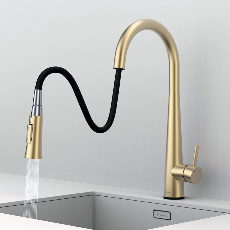 Arcus Touch Kitchen Faucet with flexible pull-down sprayer extended over sink, featuring brushed gold finish and ergonomic design by Signature Faucets. #color_brushed gold