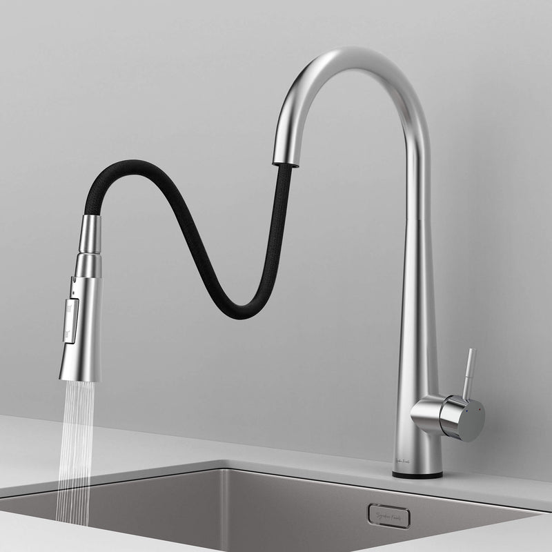 Arcus Touch Kitchen Faucet with flexible pull-down sprayer extended over sink, featuring ergonomic design and brushed nickel finish by Signature Faucets. #color_brushed nickel