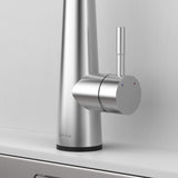 Close-up of Arcus Touch Kitchen Faucet handle in brushed nickel finish, showing sleek modern design and temperature control lever by Signature Faucets. #color_brushed nickel