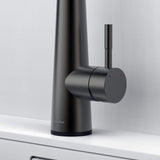 Close-up of Arcus Touch Kitchen Faucet handle in gunmetal gray finish, highlighting temperature control lever and sleek contemporary design by Signature Faucets. #color_gunmetal gray