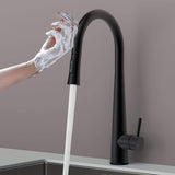 Touch-activated Arcus Kitchen Faucet with Pull-Down Sprayer in matte black finish — hands-free operation shown as soapy hands activate water flow by Signature Faucets.#color_matte black