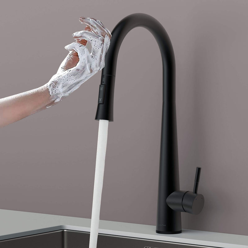 Touch-activated Arcus Kitchen Faucet with Pull-Down Sprayer in matte black finish — hands-free operation shown as soapy hands activate water flow by Signature Faucets.#color_matte black