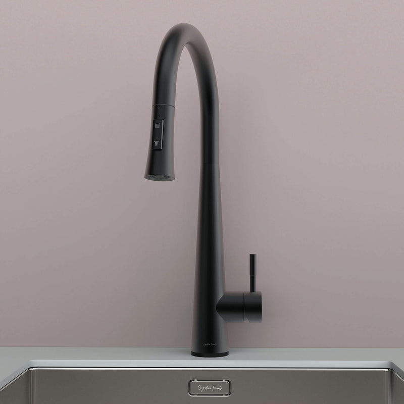 Front view of Arcus Touch Kitchen Faucet with Pull-Down Sprayer in matte black finish, installed on stainless steel sink by Signature Faucets. #color_matte black