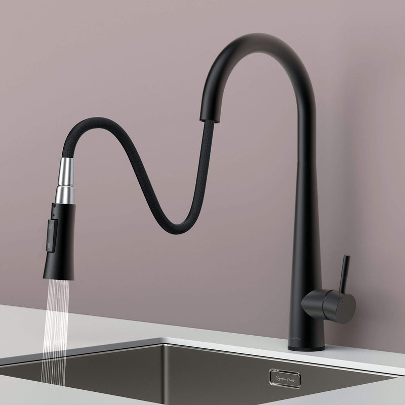Arcus Touch Kitchen Faucet with flexible pull-down sprayer extended over sink, featuring matte black finish and ergonomic design by Signature Faucets. #color_matte black