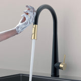 Touch-activated Arcus Kitchen Faucet with Pull-Down Sprayer in Matte Black and Brushed Gold finish — hands-free operation shown as soapy hands activate water flow by Signature Faucets. #color_matte black and brushed gold