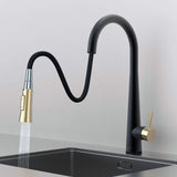 Arcus Touch Kitchen Faucet with flexible pull-down sprayer extended over sink, featuring Matte Black and Brushed Gold finish and ergonomic design by Signature Faucets. #color_matte black and brushed gold