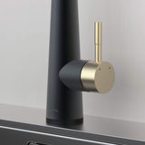 Close-up of Arcus Touch Kitchen Faucet handle in Matte Black and Brushed Gold finish, highlighting temperature control lever and sleek contemporary design by Signature Faucets. #color_matte black and brushed gold