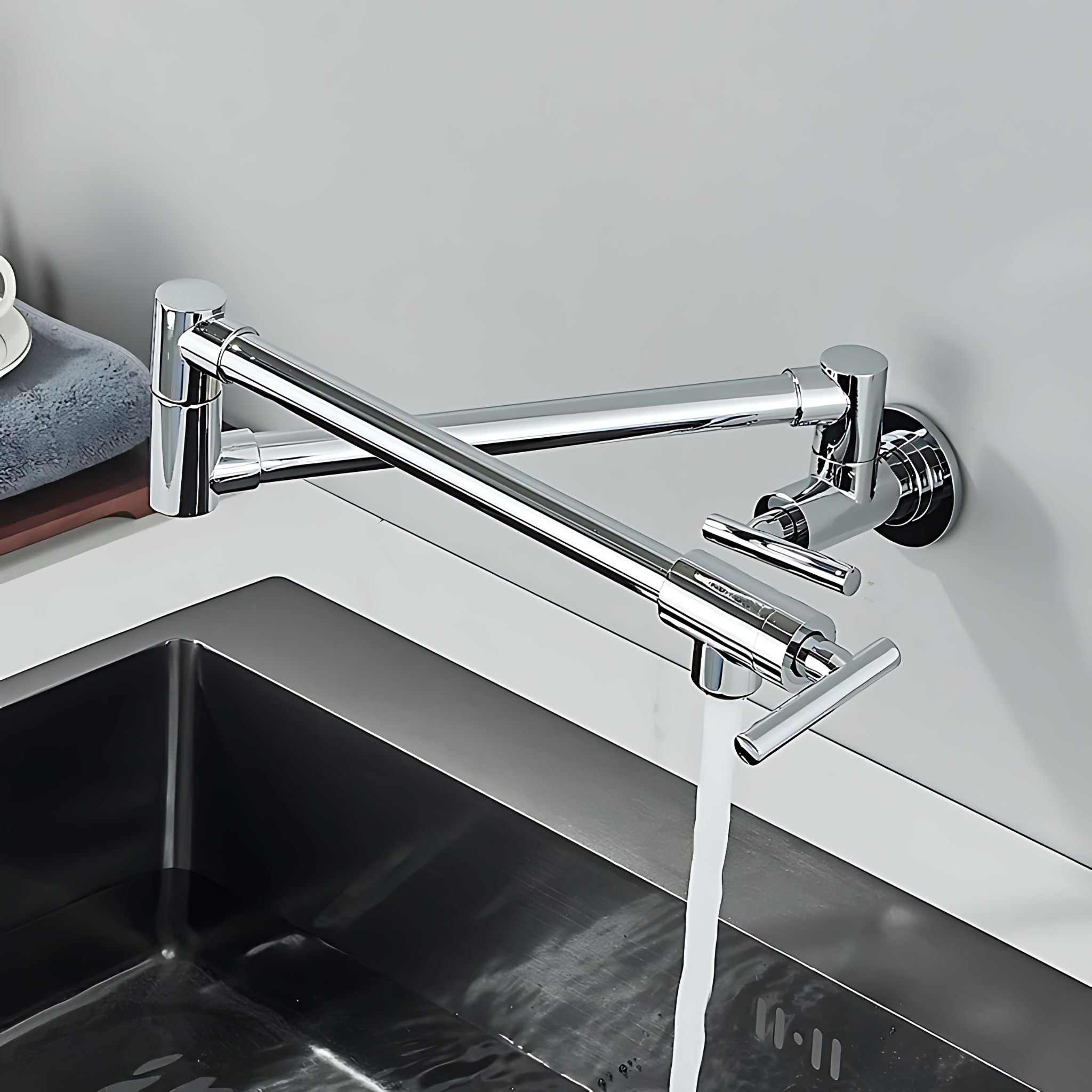 Chrome kitchen faucet mounted on a wall above a sink. #color_chrome