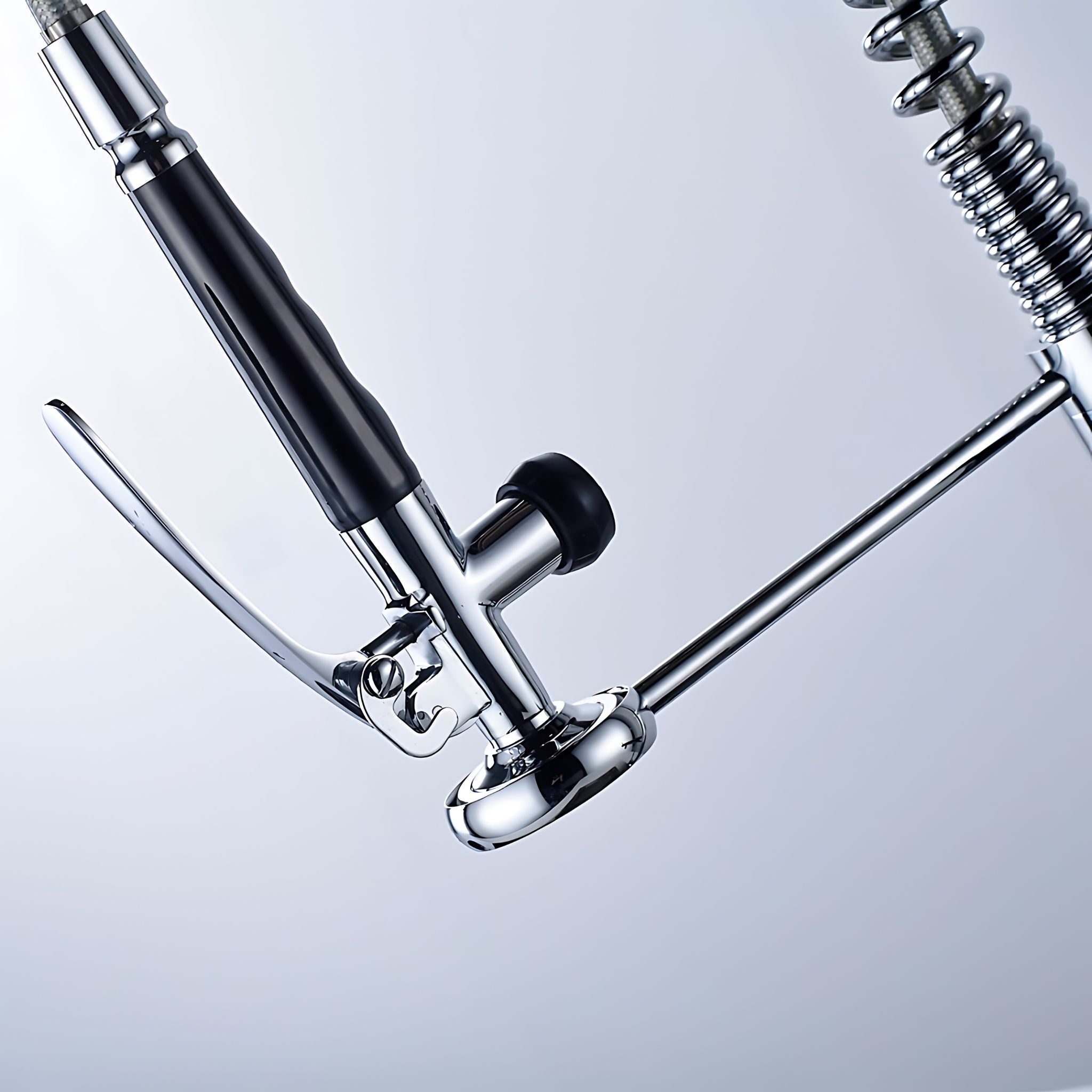 Close-up of a chrome metal stand with a black handle and black knob, shown against a light gray studio background. #color_chrome