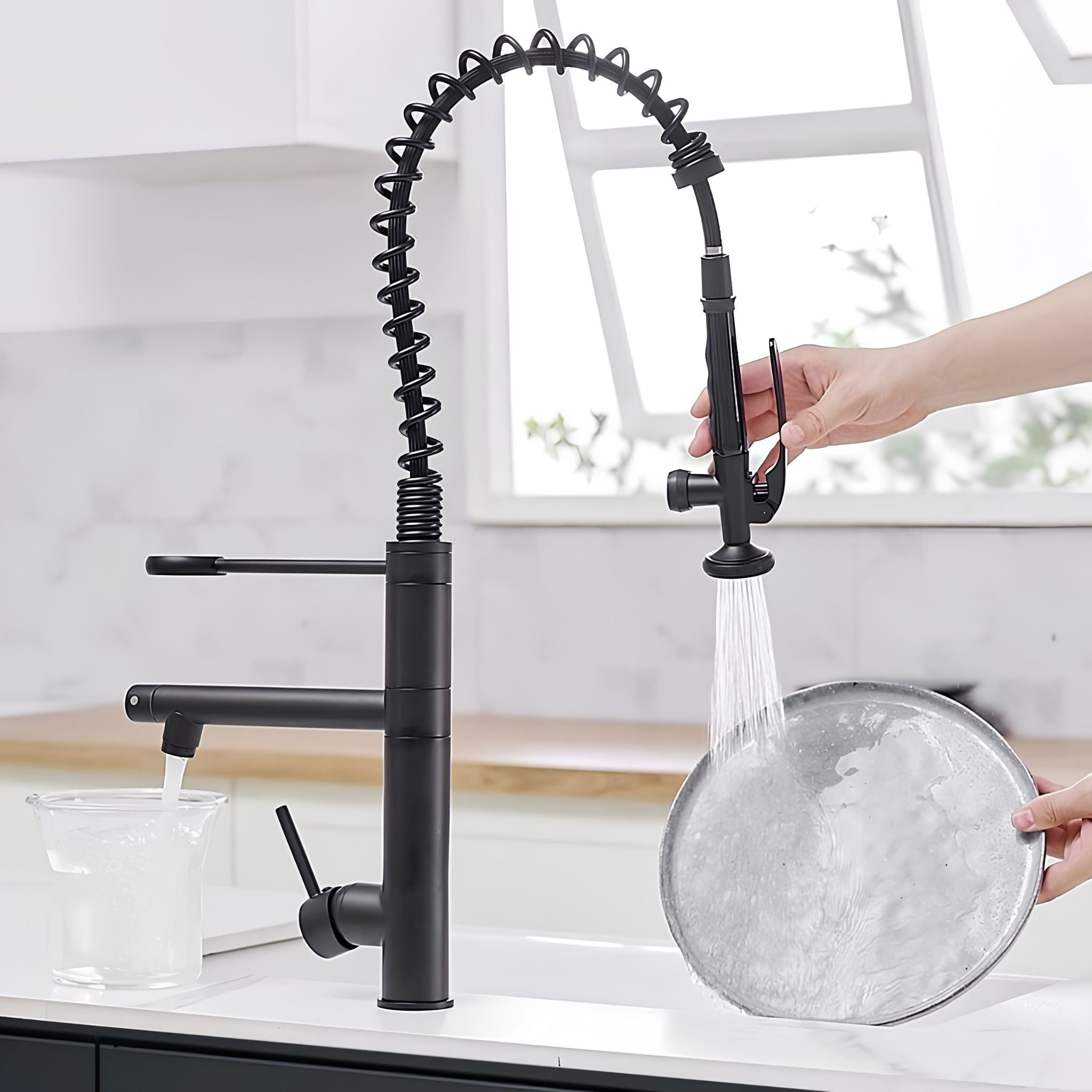 Matte Black commercial kitchen faucet, pot filler filling glass while pull-down sprayer rinses dish #color_matte black