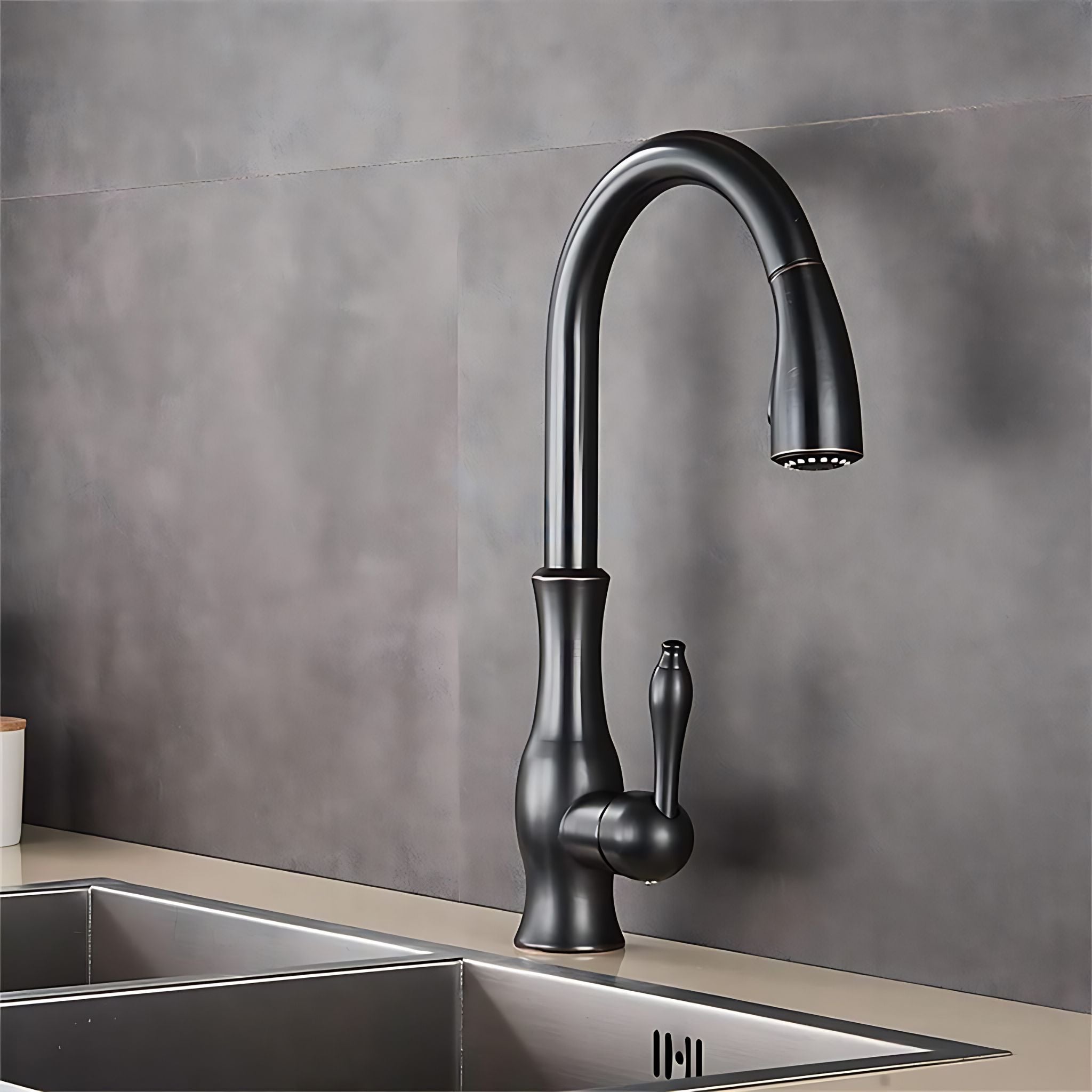A matte black single-handle kitchen faucet with a high-arc spout and pull-out spray head, installed on a stainless steel sink against a gray tiled backsplash. #color_matte black