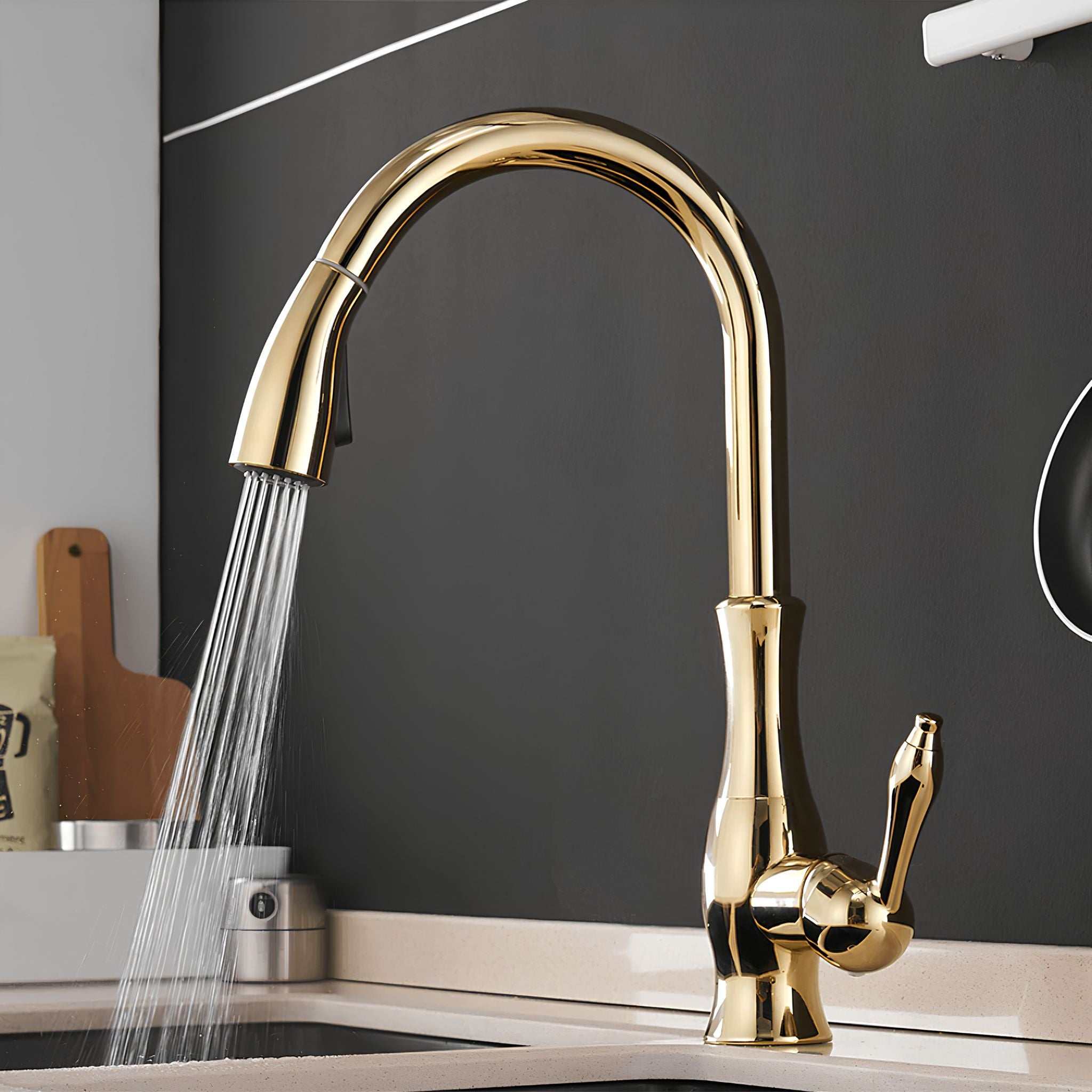 Gold kitchen faucet with spray water flowing in a kitchen setting. #color_gold