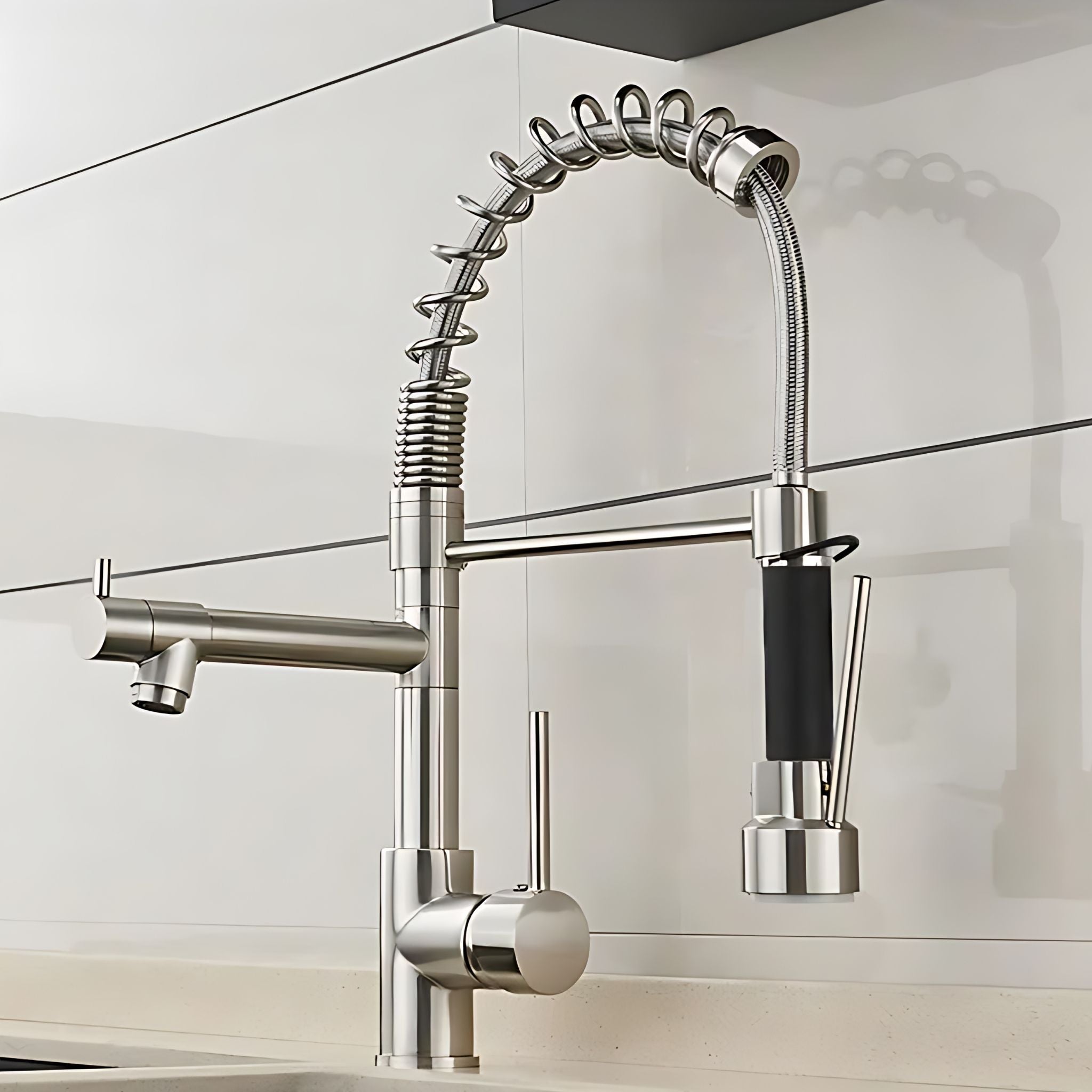 Brushed Nickel pull-down kitchen faucet with spring arch and pot filler installed in kitchen #color_brushed nickel