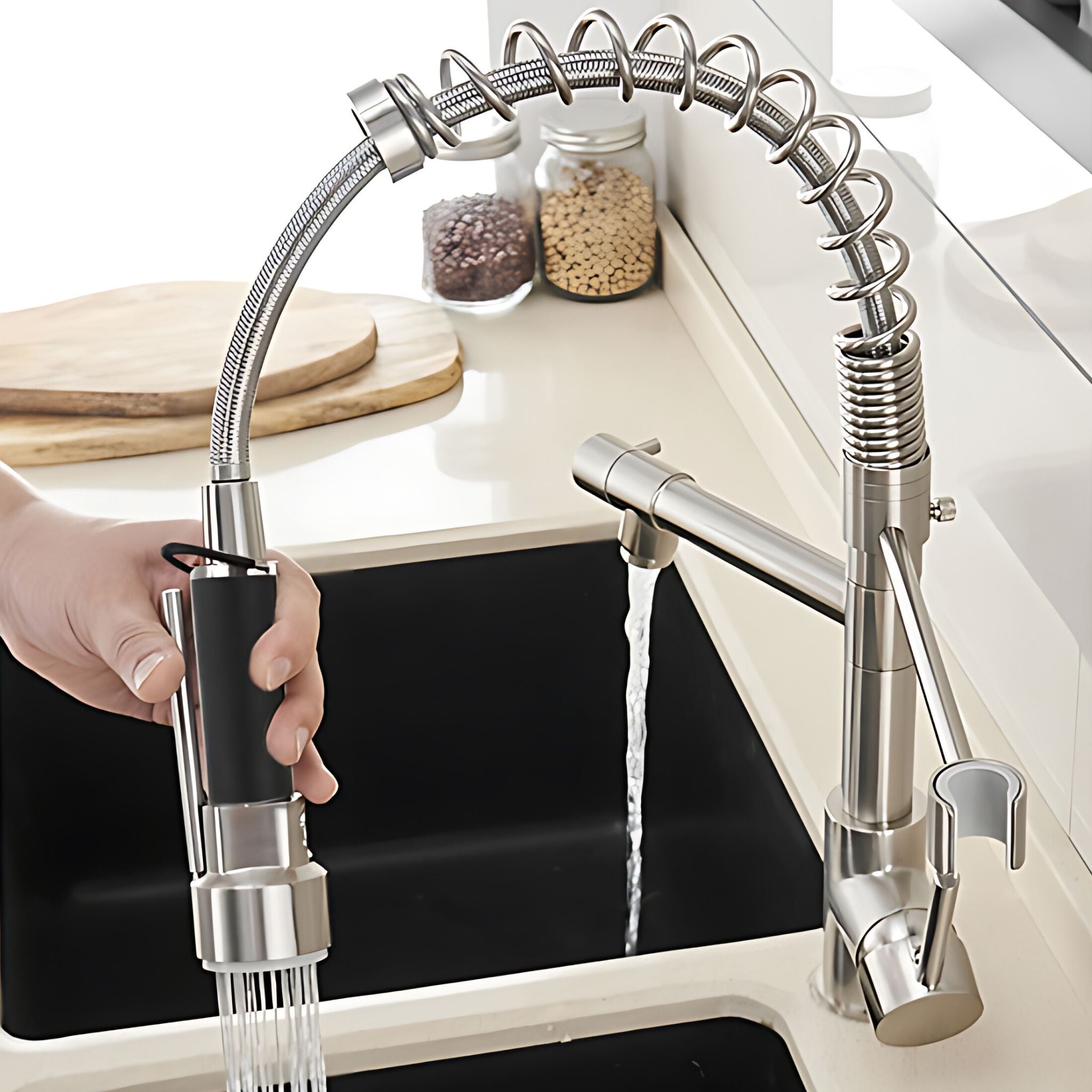 Brushed Nickel pull-down kitchen faucet demonstrating flexible spring hose reach into deep sink #color_brushed nickel