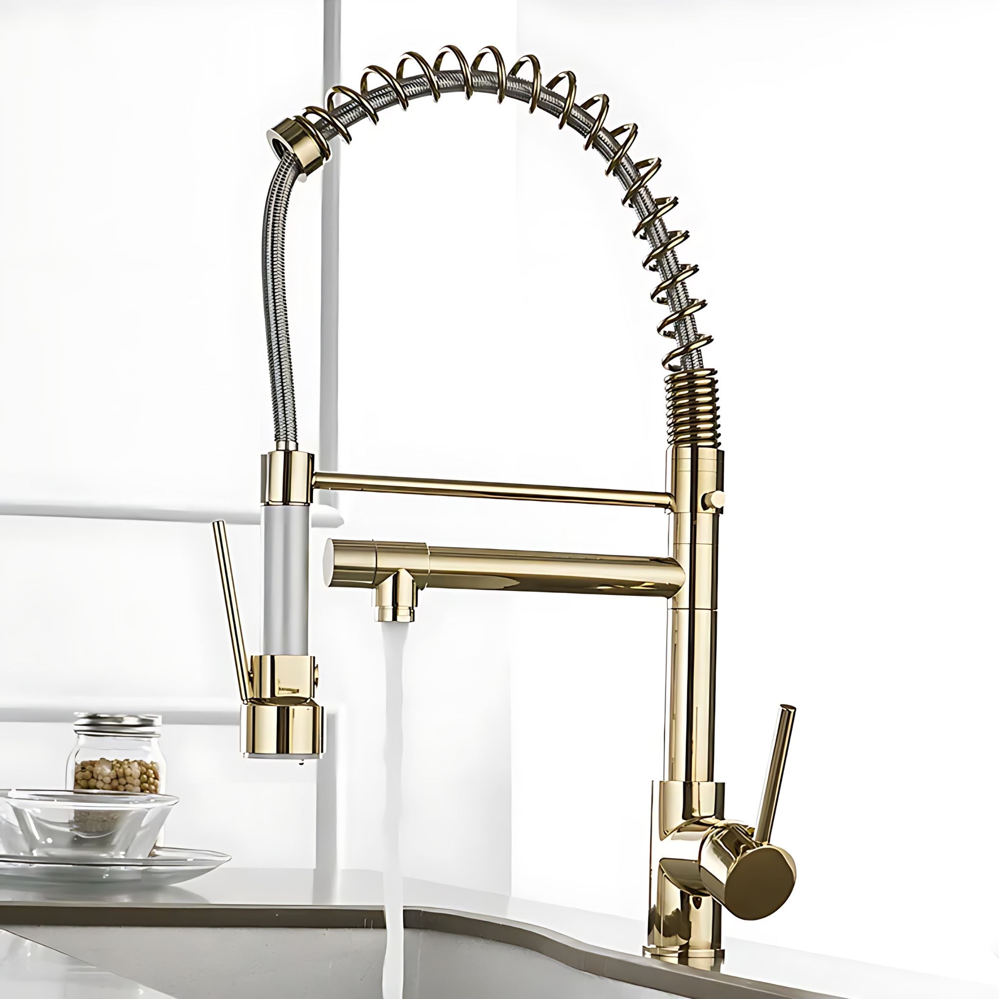 Gold pull-down kitchen faucet with spring spout delivering stream over kitchen sink #color_gold