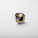 Close-up view of the underside mounting mechanism of the Berg Soap Dispenser.