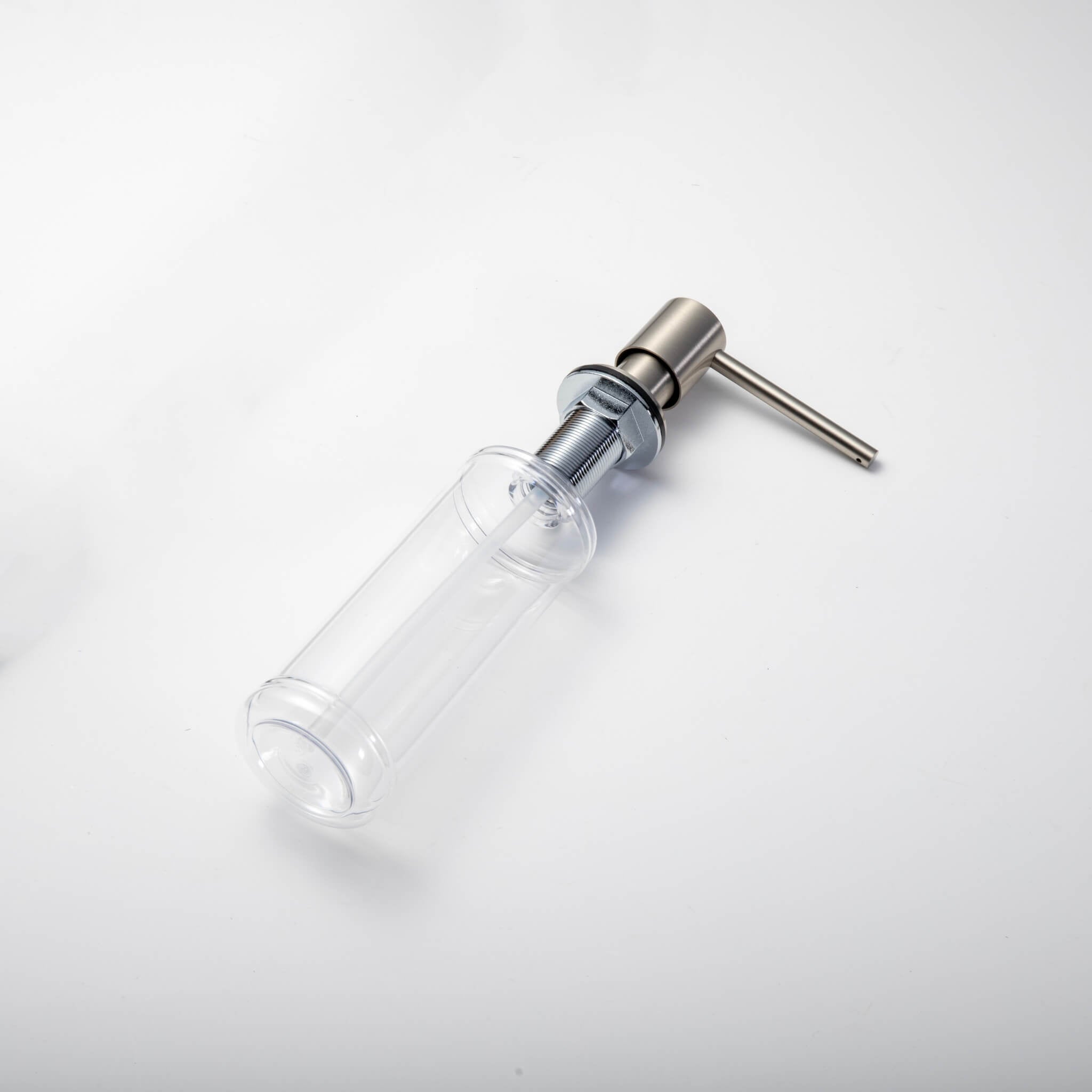 A stainless steel kitchen sink soap dispenser with a clear container and a brushed nickel finish