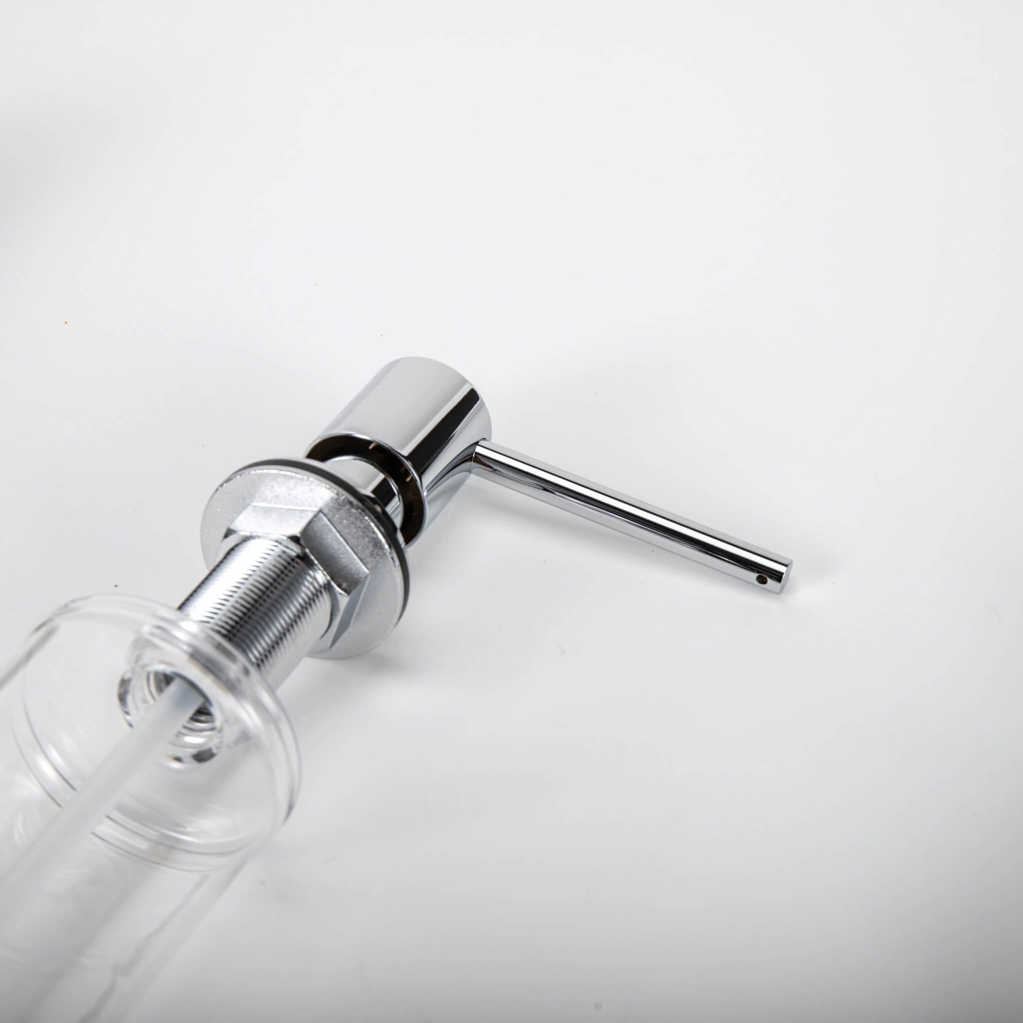 A stainless steel kitchen sink soap dispenser with a clear container and a chrome finish
