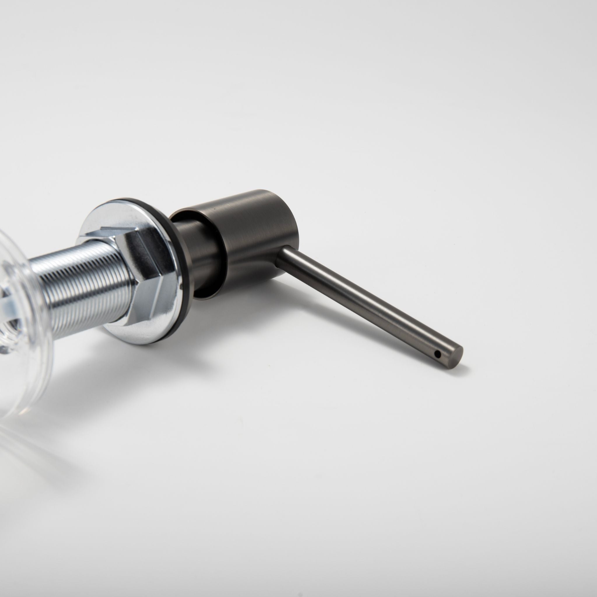 Close-up of the Berg Kitchen Sink Soap Dispenser pump head and spout in Gunmetal Gray.