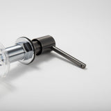 Close-up of the Berg Kitchen Sink Soap Dispenser pump head and spout in Gunmetal Gray.