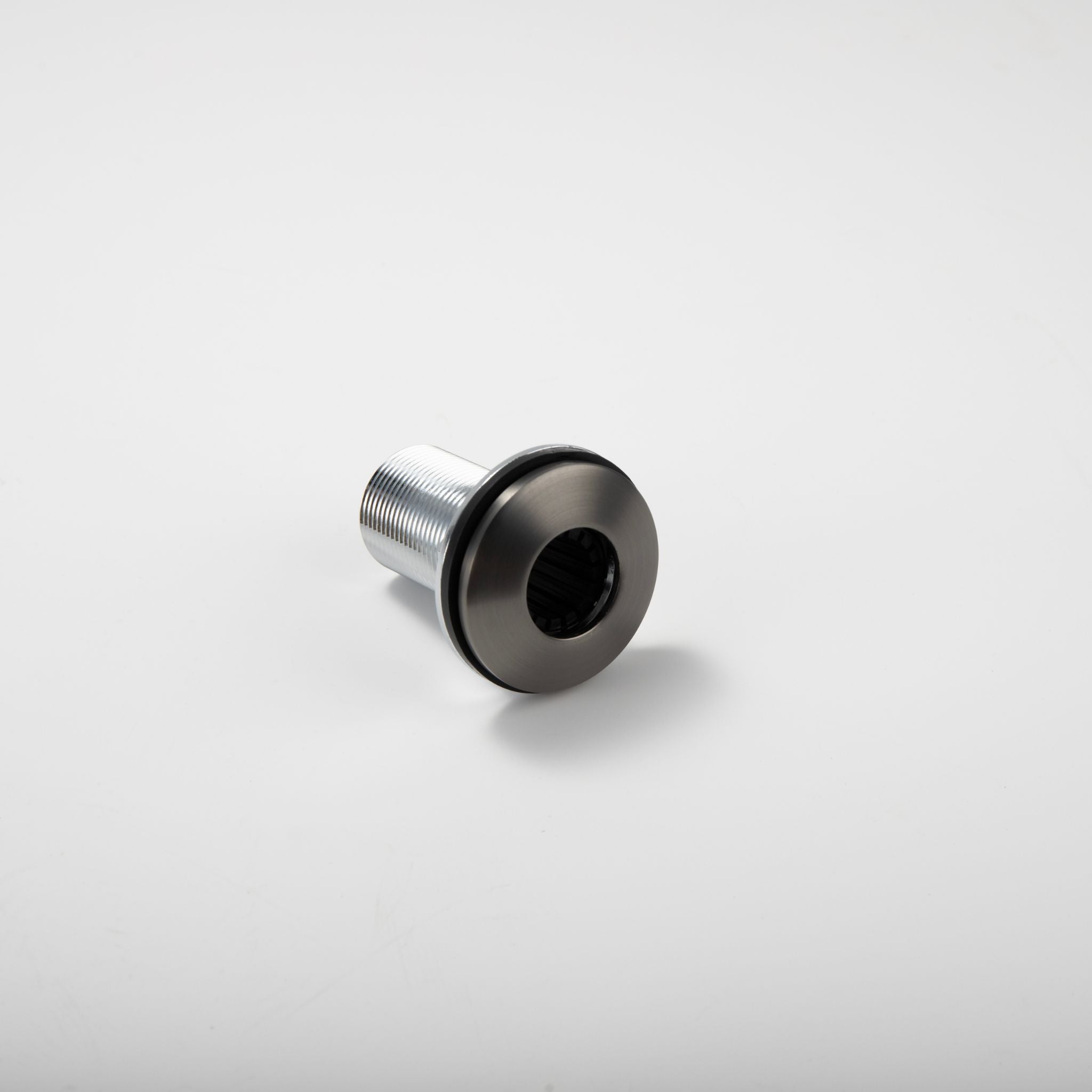 Close-up view of the underside mounting mechanism of the Berg Soap Dispenser.